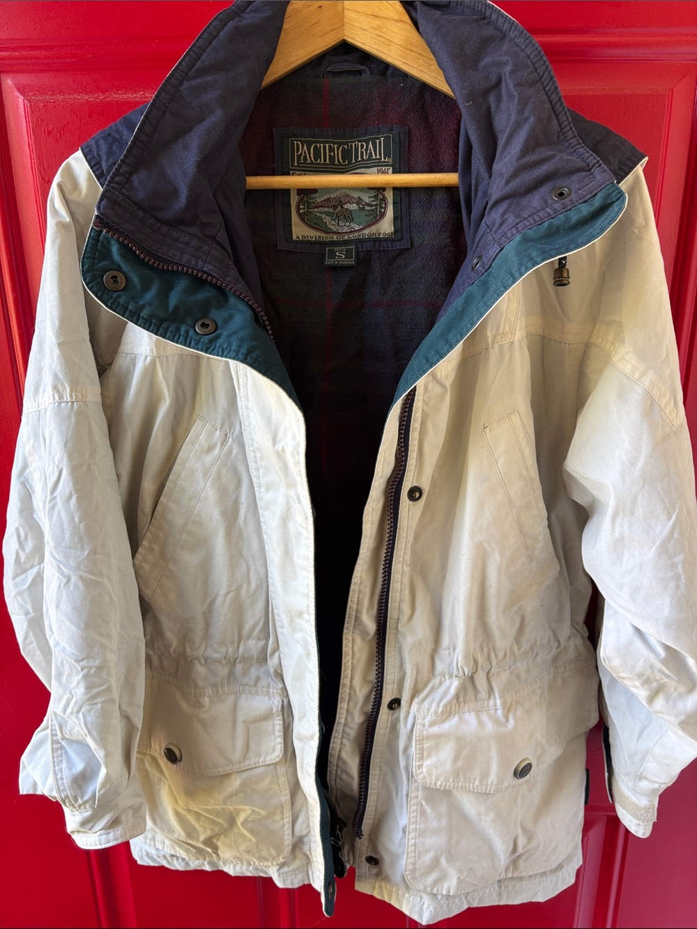 Pacific Trail Cream Jacket with Navy Hood and Teal Trim
